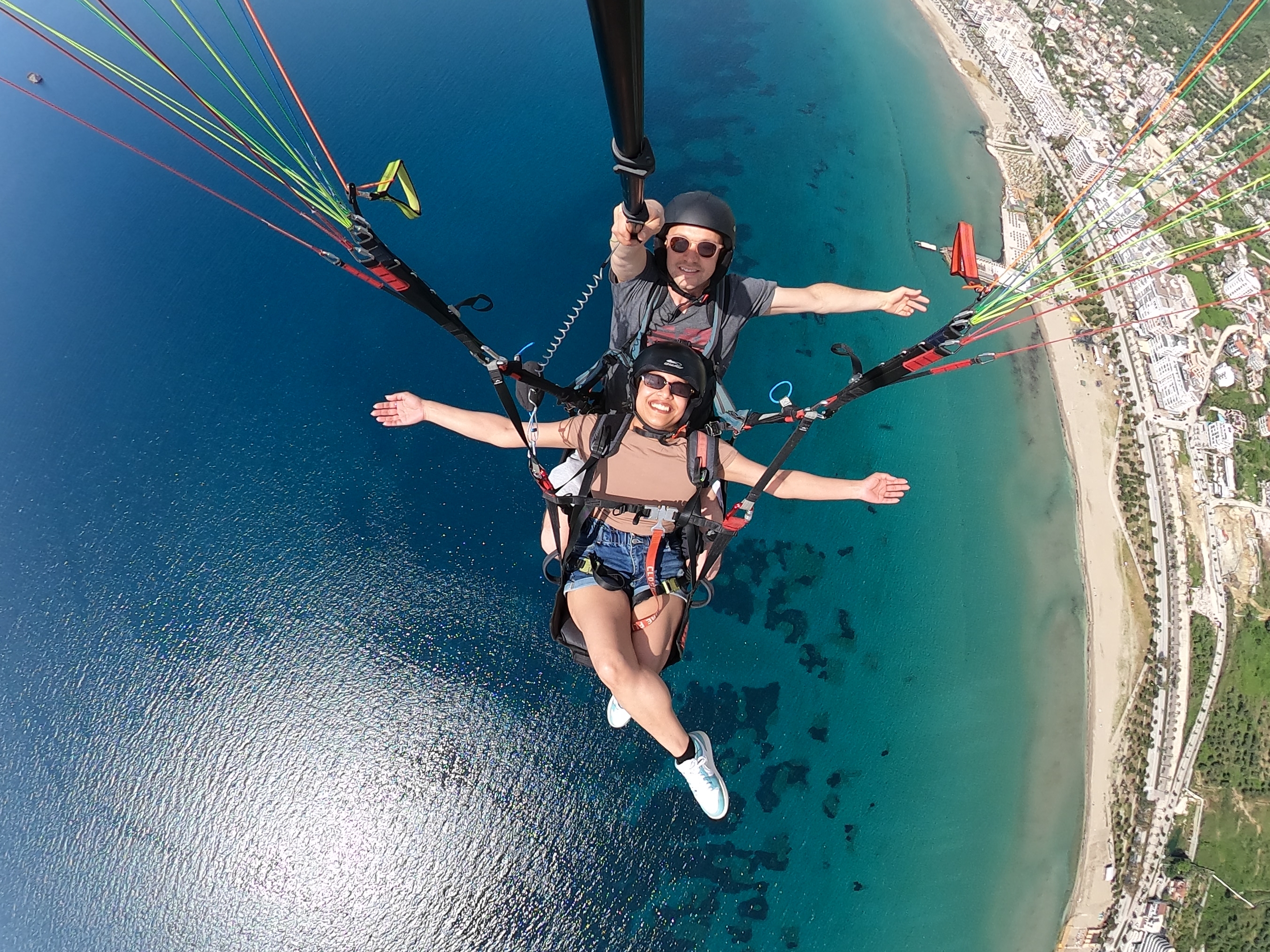 Tandem paragliding over the Albanian Riviera beach and coastline