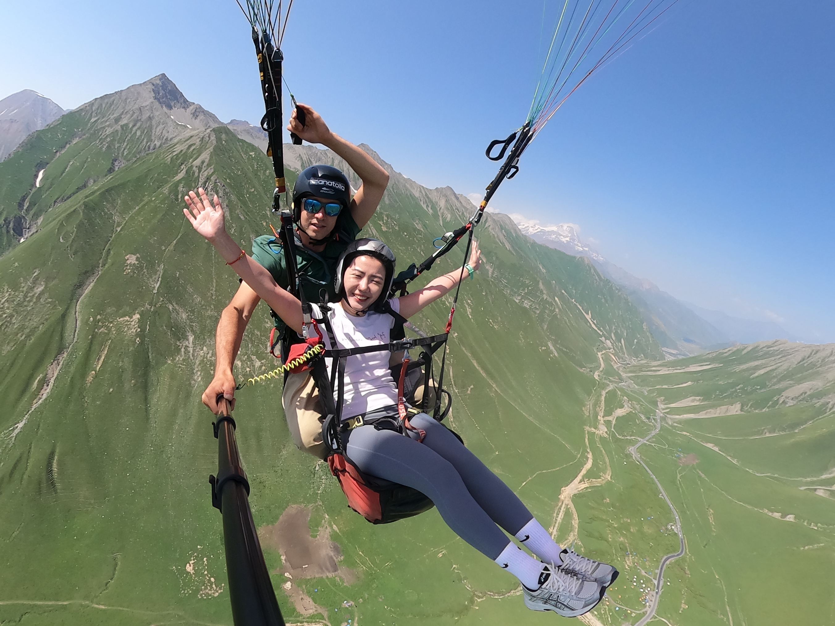 Pilot and passenger gliding high above the Albanian Riviera
