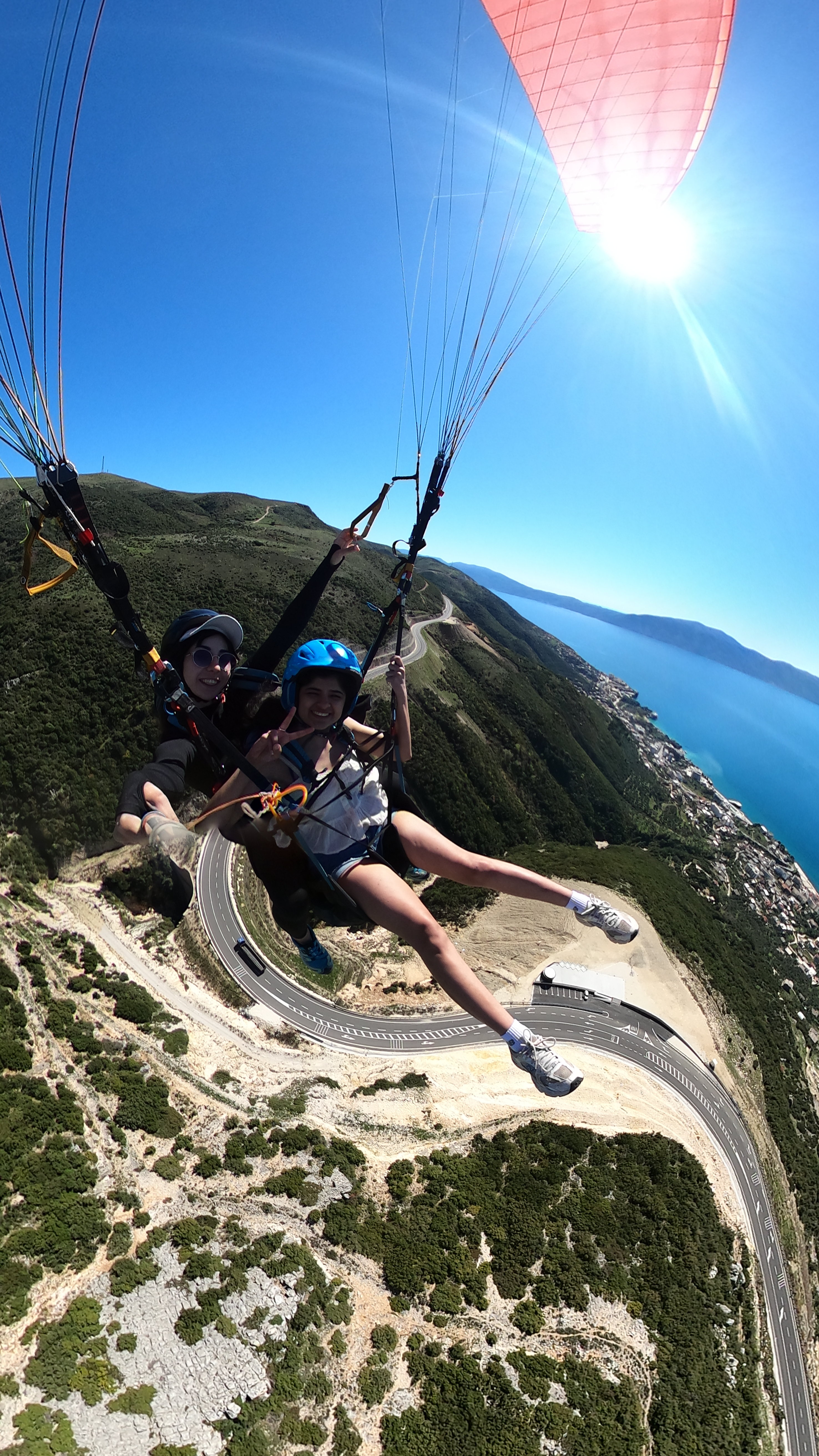 Paragliding launch preparation on a mountain take-off site